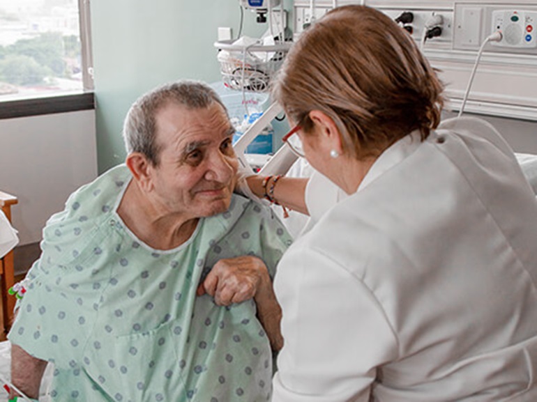 Patient with a neurological condition being treated by a therapist